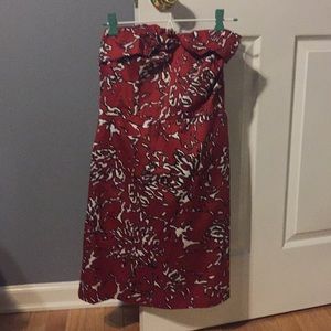 Strapless red, black, and white dress.